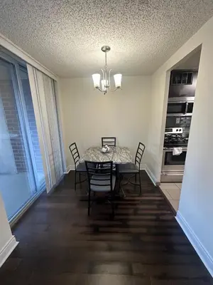 a dining room with a table and chairs and a window at 1500 Locust Apartments Luxury Living in the Heart of Philadelphia in Philadelphia