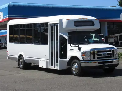 a white bus parked in front of a store at Fireflies In NYC, Cozy, Private & New in Union City