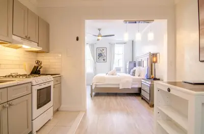 a kitchen with a bed in the middle of a room at Fireflies In NYC, Cozy, Private & New in Union City