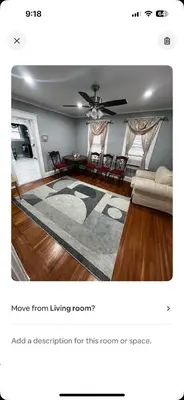 a living room with a couch and a table at Rehan in Teaneck