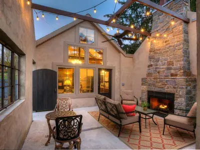 a patio with a fireplace and a stone wall at Romantic Cottage Rental Tucked Away in the Countryside near Lancaster, Pennsylvania in Columbia
