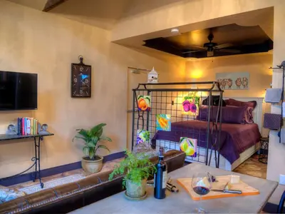 a living room with a bed and a couch at Romantic Cottage Rental Tucked Away in the Countryside near Lancaster, Pennsylvania in Columbia