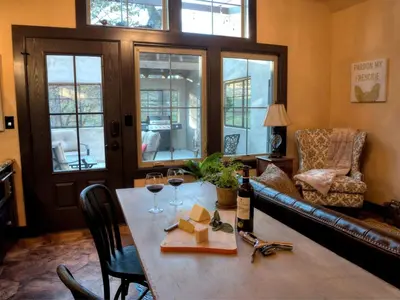 a dining room with a table with glasses of wine at Romantic Cottage Rental Tucked Away in the Countryside near Lancaster, Pennsylvania in Columbia