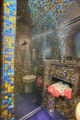 a tiled bathroom with a shower and a toilet at Unique Accommodation for a Glamping Getaway in Columbia, Pennsylvania in Columbia
