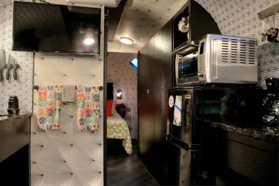 two pictures of a kitchen with a microwave at Unique Accommodation for a Glamping Getaway in Columbia, Pennsylvania in Columbia