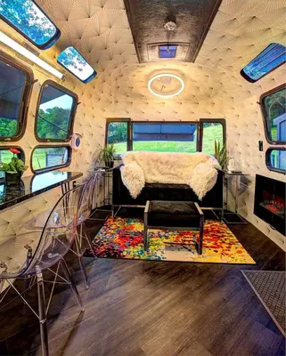 a room with a couch and chairs in a rv at Unique Accommodation for a Glamping Getaway in Columbia, Pennsylvania in Columbia