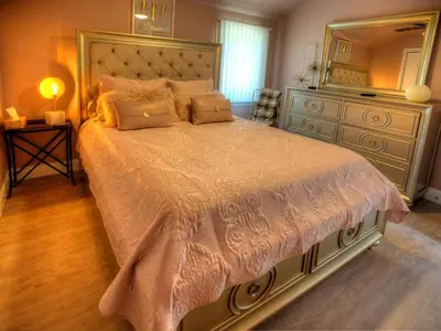 a bedroom with a large bed with a large mirror at Modern Cottage Rental on a Peaceful Farm near Amish Country in Pennsylvania in Columbia
