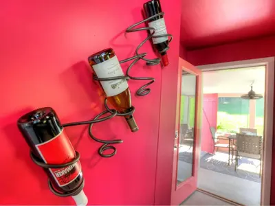 a bunch of wine bottles hanging on a wall at Modern Cottage Rental on a Peaceful Farm near Amish Country in Pennsylvania in Columbia