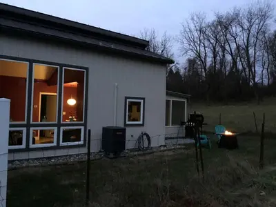 a house with a window on the side of it at Modern Cottage Rental on a Peaceful Farm near Amish Country in Pennsylvania in Columbia