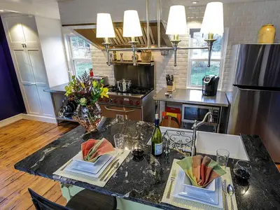 a kitchen with a table with two plates on it at Elegant Farm Cottage Rental for a Countryside Getaway near Lancaster, Pennsylvania in Columbia