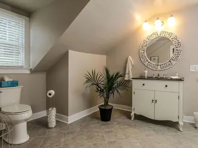 a bathroom with a toilet and a mirror at Elegant Farm Cottage Rental for a Countryside Getaway near Lancaster, Pennsylvania in Columbia