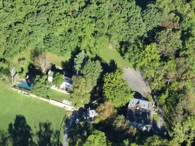 an aerial view of a house in the forest at Charming Cottage Getaway with an Indoor Fireplace in Chester Springs, Pennsylvania in Chester Springs