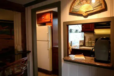 a kitchen with a white refrigerator and a counter top at Charming Cottage Getaway with an Indoor Fireplace in Chester Springs, Pennsylvania in Chester Springs