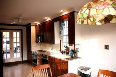 a kitchen with a sink and a stove top oven at Idyllic Cottage Getaway on a Country Estate in Chester Springs, Pennsylvania in Chester Springs