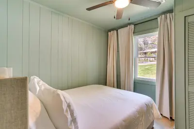a bedroom with a bed and a window at Walk to White Lake Family Home with Deck and BBQ in White Lake