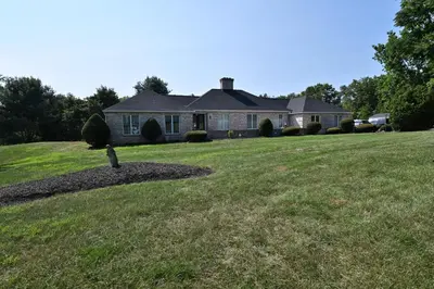 a house on a hill with a yard at Farmhouse in Hershey in Hershey