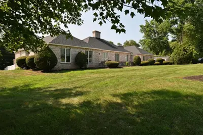 a house with a large lawn in front of it at Farmhouse in Hershey in Hershey