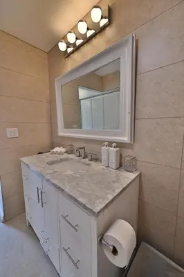 a bathroom with a sink and a mirror at Farmhouse in Hershey in Hershey