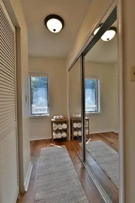 a hallway with a mirror in a home at Farmhouse in Hershey in Hershey