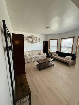 a living room with a couch and a coffee table at Cozy 3BR Apartment with Private Entry & Parking in Elizabeth, NJ in Elizabeth
