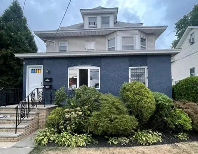 a blue house with a white at Cozy 3BR Apartment with Private Entry & Parking in Elizabeth, NJ in Elizabeth
