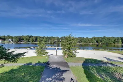 an empty park with a lake in the background at Poconos Hot Tub Haven! 14 Mi to Camelback Resort in Pocono Country Place