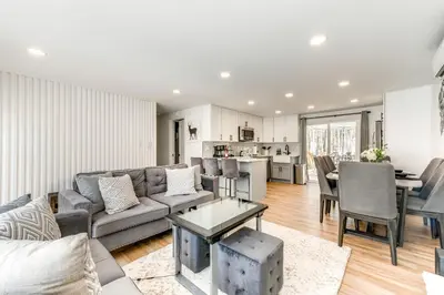 a living room with a couch and a table at Poconos Hot Tub Haven! 14 Mi to Camelback Resort in Pocono Country Place