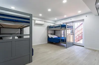 a room with two bunk beds and a door at Beautiful Modern Lodge! Game Room in Saw Creek