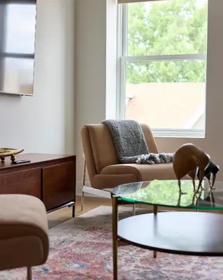 a living room with a couch and a table at Sunny 2BR Loft • Work Relax Minutes to NYC in Hoboken