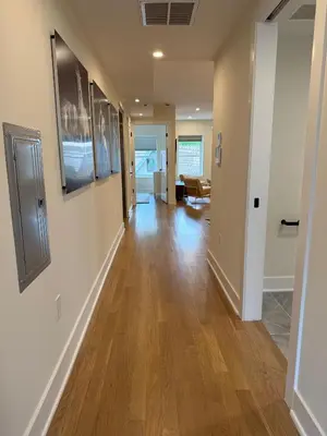 a hallway of a home with wooden floors at Hoboken 3BR Queen Loft in Hoboken