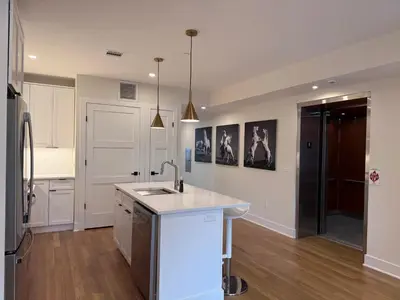 a kitchen with a sink and a counter top at Hoboken 3BR Queen Loft in Hoboken
