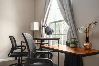a room with a table and chairs and a window at Spacious & Serene Family Gem: Games, Office, Yard! in Pennsburg