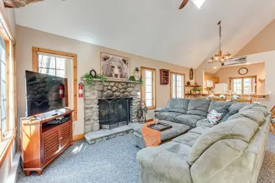 a living room with a couch and a fireplace at Access to Jack Frost Ski Resort Home with Hot Tub in White Haven