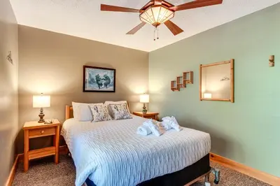 a bedroom with a bed with a ceiling fan at Access to Jack Frost Ski Resort Home with Hot Tub in White Haven