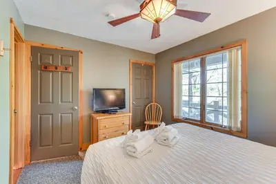 a bedroom with a bed and a tv and a ceiling fan at Access to Jack Frost Ski Resort Home with Hot Tub in White Haven