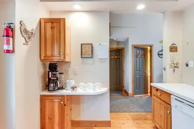 a kitchen with wooden cabinets and a counter top at Access to Jack Frost Ski Resort Home with Hot Tub in White Haven