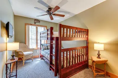 a room with a bunk bed and a ceiling fan at Access to Jack Frost Ski Resort Home with Hot Tub in White Haven