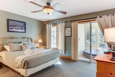 a bedroom with a bed with a ceiling fan at Access to Jack Frost Ski Resort Home with Hot Tub in White Haven