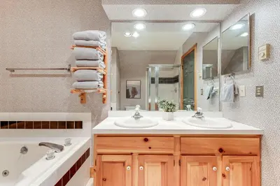 a bathroom with two sinks and a large mirror at Access to Jack Frost Ski Resort Home with Hot Tub in White Haven