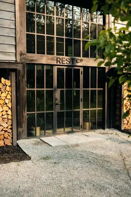 an entrance to a building with a large glass door at The Rest Suite 5 in Kenoza Lake