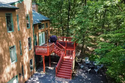 an overhead view of a house with a red staircase at Twin Pines Retreat Hot Tub Theater Room Fire in East Stroudsburg