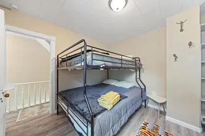 a bedroom with two bunk beds in a room at Comfort, Fun, and Retro Retreat in Royersford