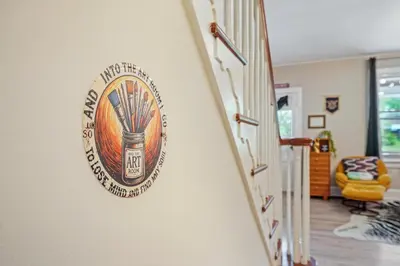 a sign on the wall of a hallway at Comfort, Fun, and Retro Retreat in Royersford