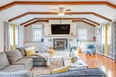 a living room with a couch and a fireplace at Game Room, Deck and Fire Pit Covington Township Gem in Daleville
