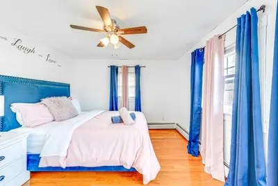 a bedroom with a bed and a ceiling fan at Game Room, Deck and Fire Pit Covington Township Gem in Daleville