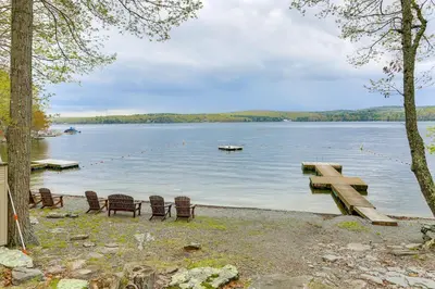 a group of chairs and a dock on a lake at half Mi to Boat Ramp Lake Wallenpaupack Retreat! in Lakeville