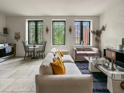 a living room with a couch and a table at Apartmint at South St - Philadelphia in Philadelphia