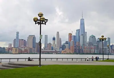a park with a view of a large city at City Escape with 2 Baths, 10 beds and We Pay Half Parking for 2 cars, NYC in 15 min in Hoboken