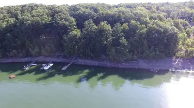 an aerial view of a lake with two boats in it at Lakefront Vacation Rental with Superb Views over Lake Wallenpaupack in Hawley, Pennsylvania in Hawley
