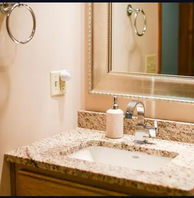 a bathroom with a sink and a mirror at Stunning Cabin Rental with a Hot Tub Overlooking Fishing Creek near Sproul State Forest, Pennsylvania in Mill Hall